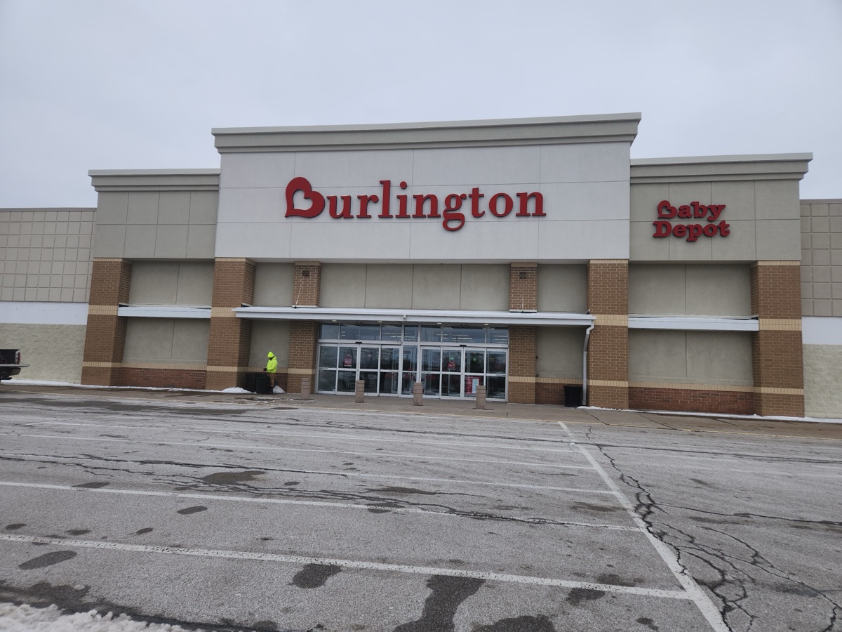 Burlington and Baby Depot storefront in Erie, Pennsylvania, with red lettering on a beige facade and a snowy parking lot