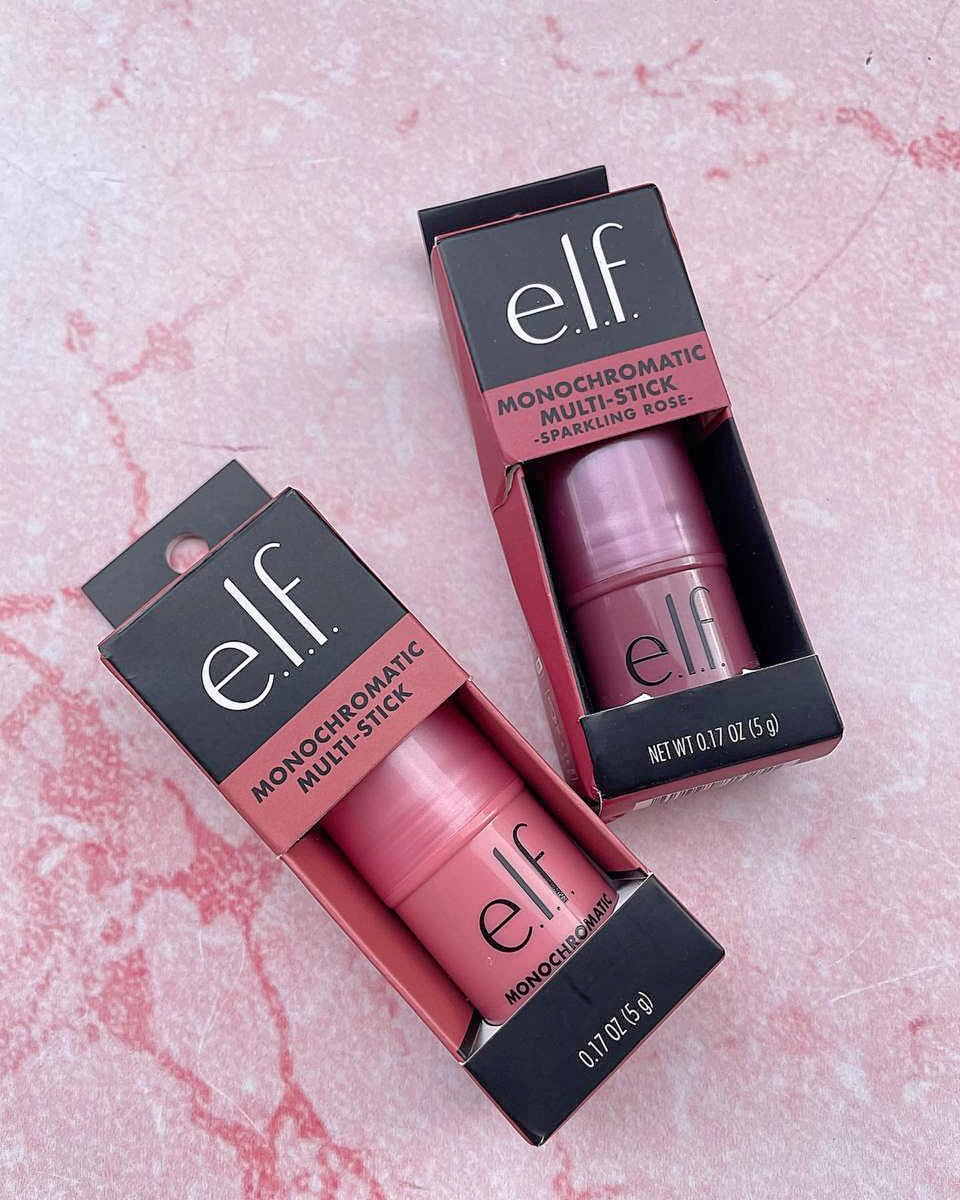 Two boxed e.l.f. Monochromatic Multi Sticks on pink marble, cartons printed with net weight 0.17 oz 5 g